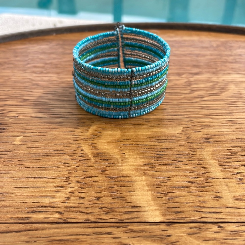 Turquoise colored handmade beaded bracelet cuff